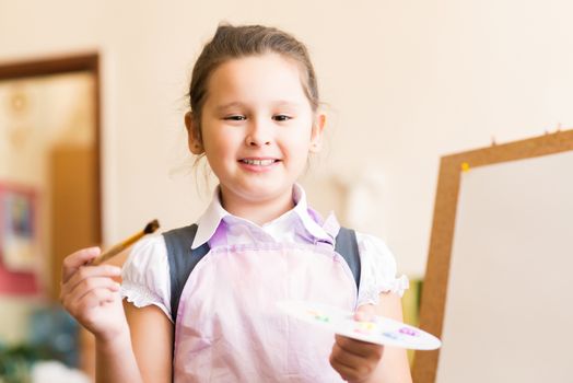 portrait of a girl standing next to his easel, a drawing lesson