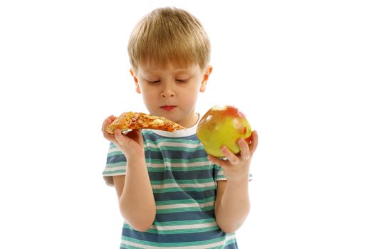 Little Boy in Striped T-Shirt Making Hard Choice between Pizza and Apple 