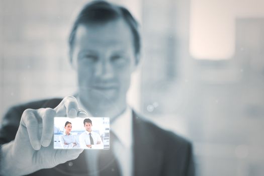 Businessman presenting digital interface of coworkers