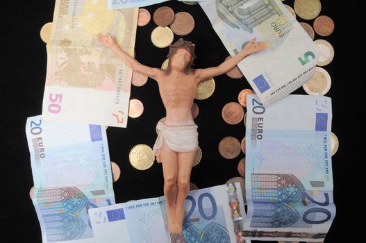 Jesus Christ and Money on a Dark Background - Religion Concept