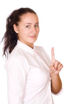 Happy young business woman pointing upwards