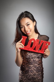 Romantic people in love shot in studio isolated on a grey background