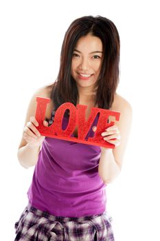 Attractive asian girl in her twenties isolated on a plein background shot in a studio