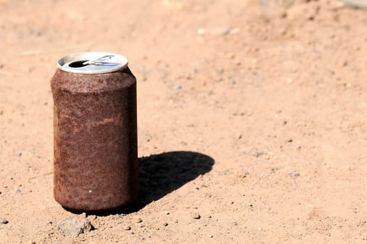 Old Rusty Can on the Floor into the Wild