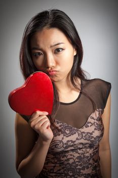 Romantic people in love shot in studio isolated on a grey background