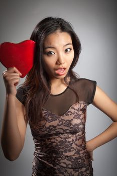 Romantic people in love shot in studio isolated on a grey background