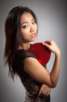 Romantic people in love shot in studio isolated on a grey background