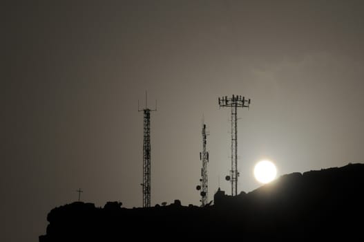 Some Silhouetted Antennas on the top of a Hill