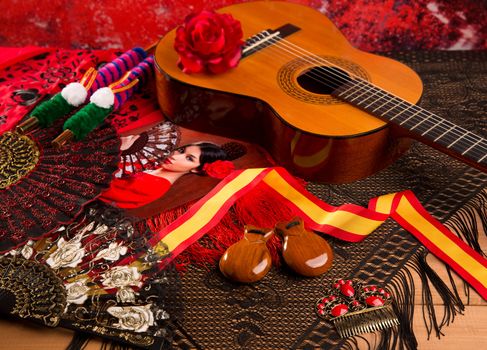 Classic spanish guitar with flamenco elements as comb fan and castanets