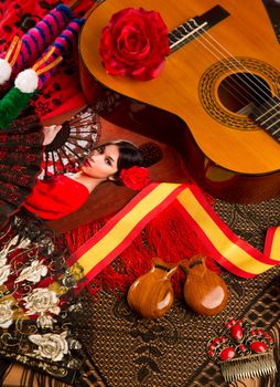 Classic spanish guitar with flamenco elements as comb fan and castanets