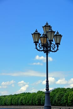 Lantern on a background of the sky and trees