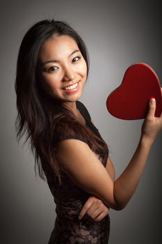 Romantic people in love shot in studio isolated on a grey background