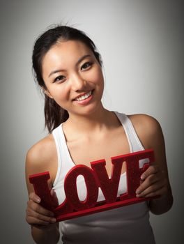 Romantic people in love shot in studio isolated on a grey background