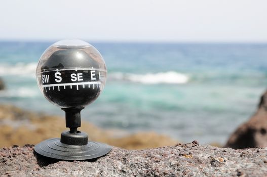 One Compass on the Rocks near the Atlantic Ocean