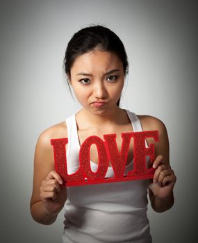 Romantic people in love shot in studio isolated on a grey background