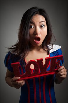 Romantic people in love shot in studio isolated on a grey background