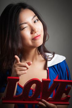 Romantic people in love shot in studio isolated on a grey background