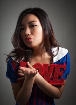 Romantic people in love shot in studio isolated on a grey background