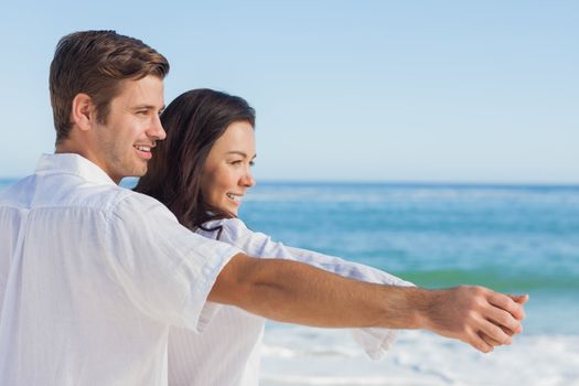 Romantic couple relaxing on the beach during the summer