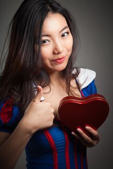 Romantic people in love shot in studio isolated on a grey background