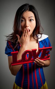 Romantic people in love shot in studio isolated on a grey background