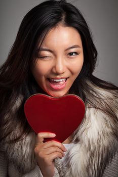 Romantic people in love shot in studio isolated on a grey background