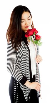 Attractive asian girl in her twenties isolated on a plein background shot in a studio