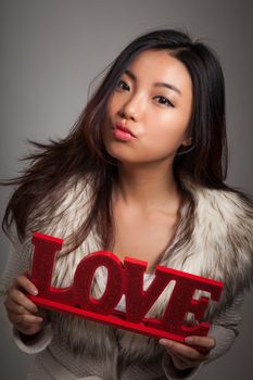 Romantic people in love shot in studio isolated on a grey background