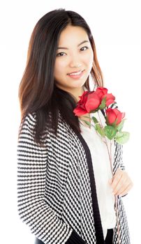 Attractive asian girl in her twenties isolated on a plein background shot in a studio