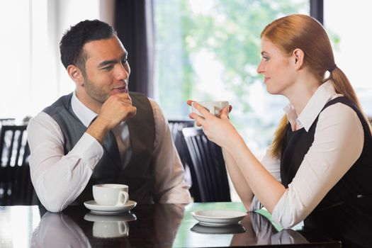 Business people talking over coffee in a cafe