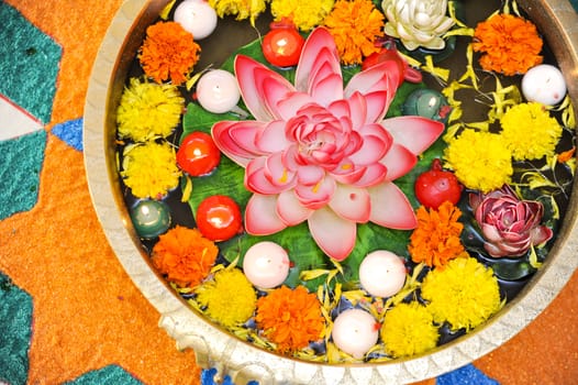 Top view of an Indian flower decoration with coloured sands