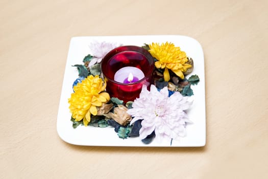 Indian table top flower decoration on a square plate