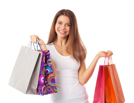 Young beautiful woman holding shopping bags, isolated on white