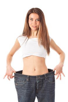 Young woman looking surprised showing how much weight she lost, isolated on white