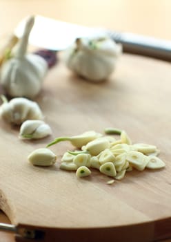 chopped garlic on a wooden board, selective focus