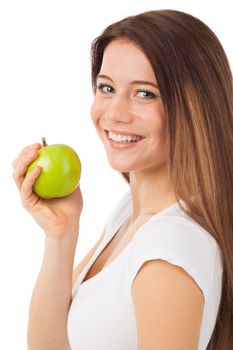 Beautiful young woman eating a green apple, isolated on white
