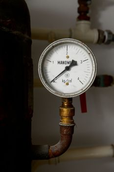 Manometer on an old rusty gas tank