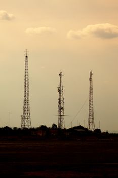 Old radio towers against twilight sky