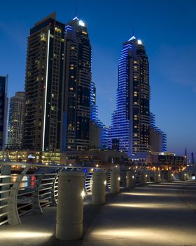 Bright lights Dubai marina scene at night