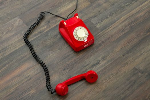 Red vintage phone on the floor