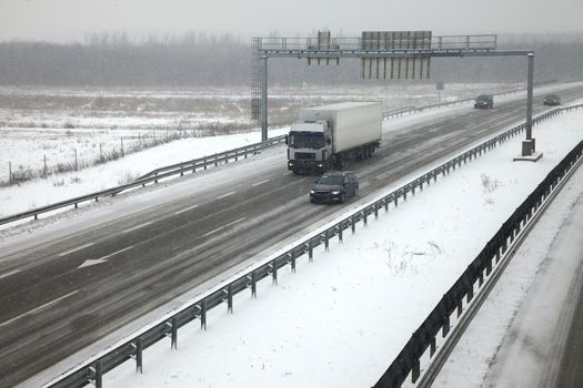 Highway traffic in heavy snowfall