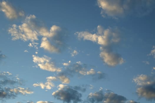 A blue cloudy sky photographed at sunset