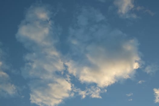A blue cloudy sky photographed at sunset
