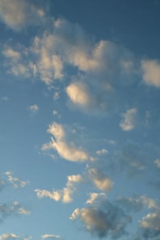 A blue cloudy sky photographed at sunset