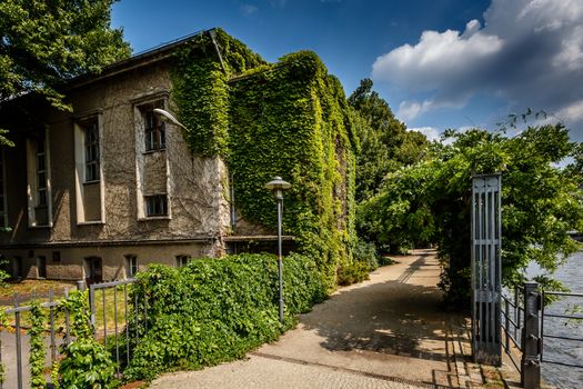 River Spree Embankment and House with Grape Vines, Berlin, Germany