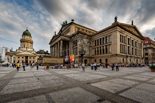 BERLIN, GERMANY - AUGUST 10: German Cathedral and Gendarmenmarkt Square on August 10, 2013 in Berlin, Germany. The square was created by Johann Arnold Nering at the end of the seventeenth century.