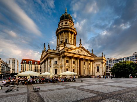 BERLIN, GERMANY - AUGUST 10: German Cathedral and Gendarmenmarkt Square on August 10, 2013 in Berlin, Germany. The square was created by Johann Arnold Nering at the end of the seventeenth century.