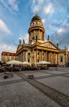 BERLIN, GERMANY - AUGUST 10: German Cathedral and Gendarmenmarkt Square on August 10, 2013 in Berlin, Germany. The square was created by Johann Arnold Nering at the end of the seventeenth century.