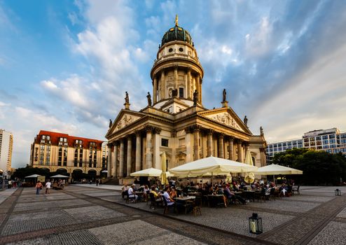 BERLIN, GERMANY - AUGUST 10: German Cathedral and Gendarmenmarkt Square on August 10, 2013 in Berlin, Germany. The square was created by Johann Arnold Nering at the end of the seventeenth century.