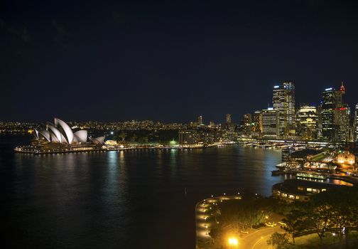 sydney harbour with opera house in australia by night